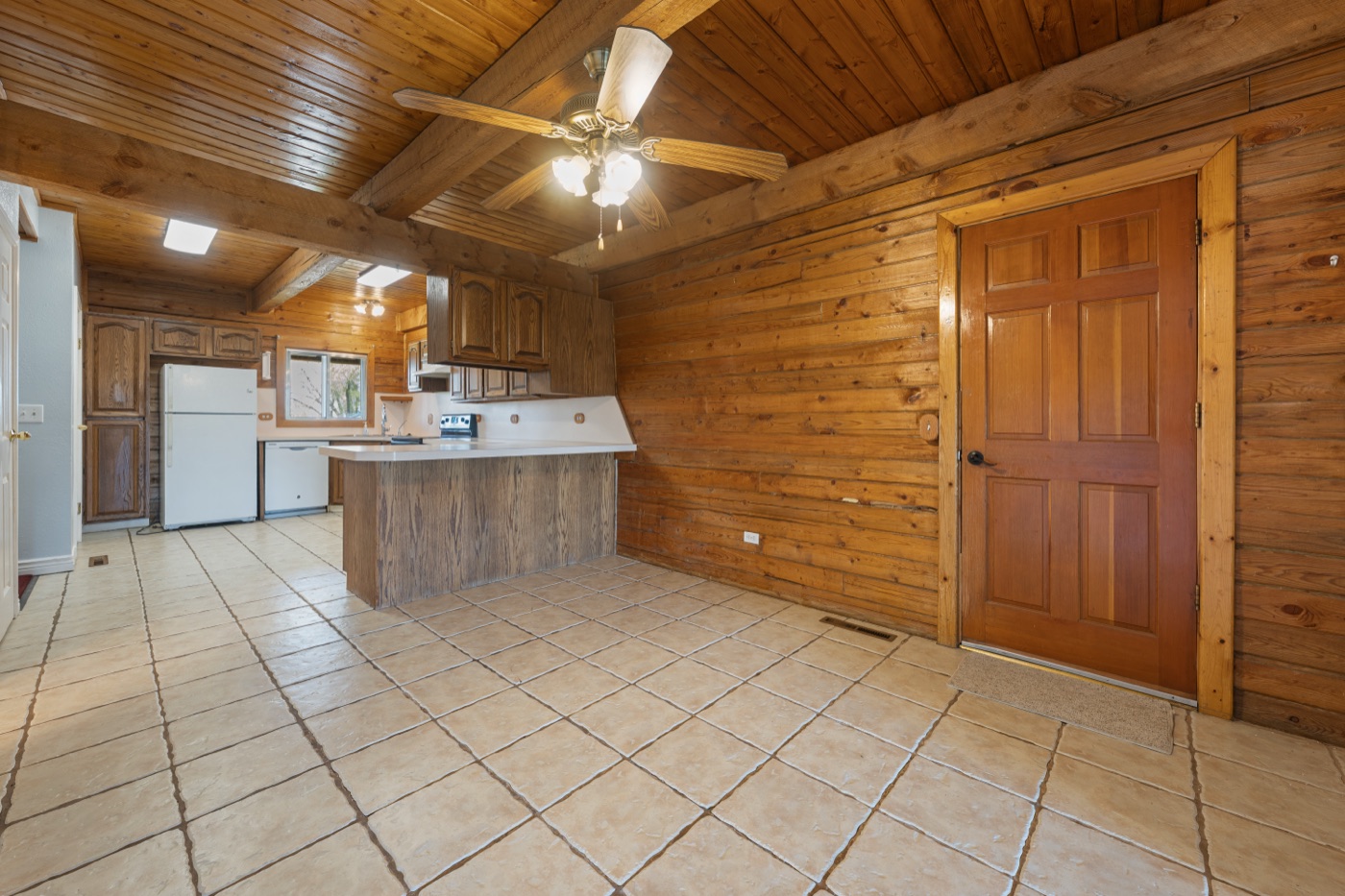 Kitchen breakfast bar with wood walls and beams