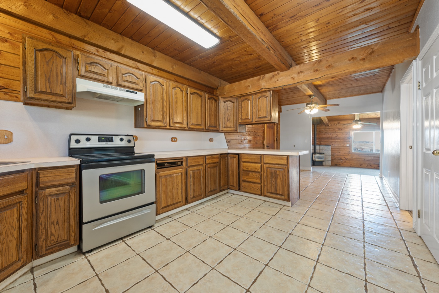 Kitchen with wood ceiling and oak cabinets